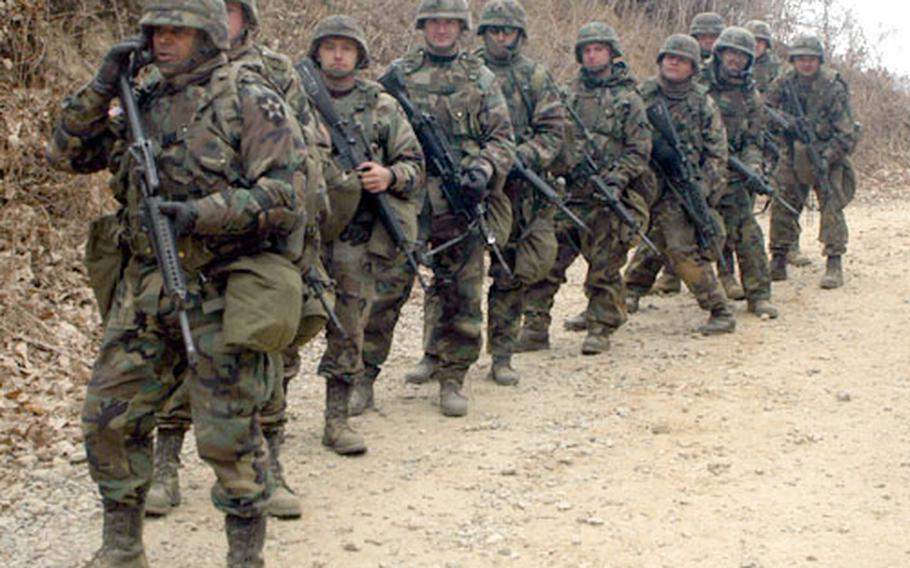 Soldiers from the 702nd Main Suppport Battalion prepare to go live Tuesday at Storey Range, South Korea.