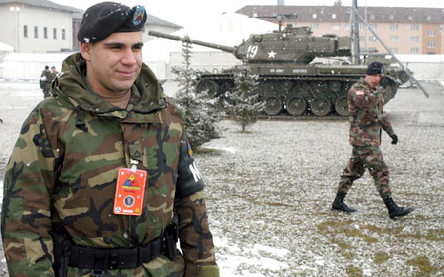 Pfc. Jason Epstein of Wiesbaden’s 501st Military Police Company shows the other side of a presidential visit — extra guard duty at points all around the base. But Epstein had it better than some: members of the German police were seen on autobahns near the base Wednesday, performing lonely foot patrols along highways leading into the facility.