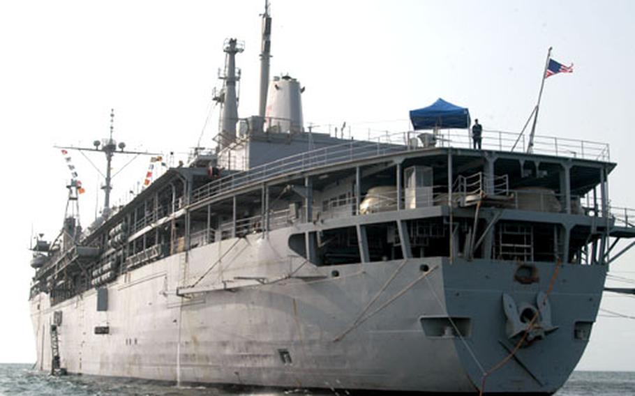 The USS Emory S. Land, a submarine tender homeporting in La Maddalena, Sardinia, anchored about three miles from the shores of Libreville, the capital of Gabon.
