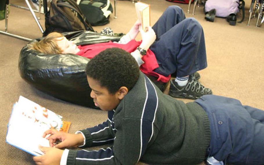 Fifth-grade pupils at the Schweinfurt Elementary School take time out during class to read their favorite book on Read Across America Day.