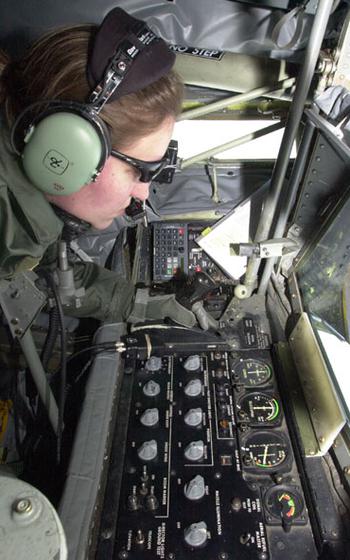 Tech Sgt. Michele Pfaff lines up a boom pipe to refuel an AWACS reconnaisance plane about 120 miles off Okinawa’s coast Tuesday. Pilots from the Japanese Air Self Defense Force observed from both planes as Kadena Air Base and Illinois National Guard airmen performed the transfer.