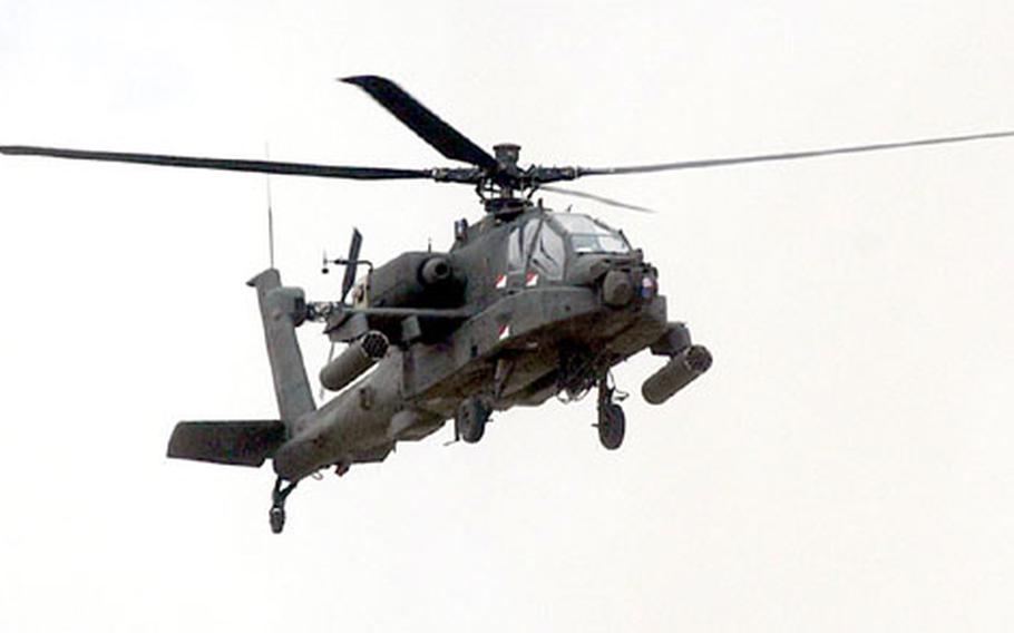 An AH-64 Apache Longbow comes in for a landing at Bagram Air Base following a mission. With Afghanistan’s mountainous terrain, the best way to move troops and equipment is through the air.