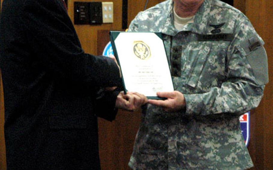 Kim Yong-tae, who works as a labor adviser in the 8th Army’s G-1 section, was honored Tuesday for working for U.S. Forces Korea for more than 50 years. USFK commander Gen. Leon J. LaPorte thanked Kim for his service and presented him with a certificate and a 50-year pin.