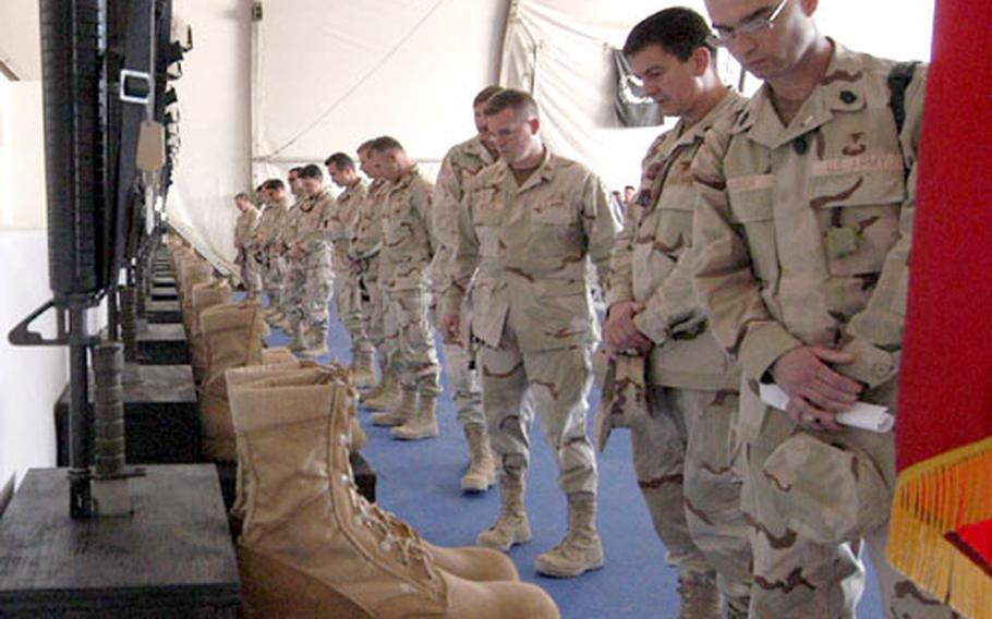 Paying last respects to the servicemembers and civilians killed in the crash of a CH-47 Chinook in Afghanistan on April 6, following the Combined/Joint Task Force-76 memorial service at Bagram Air Base on Friday.