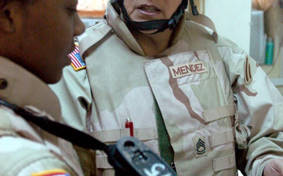Sgt. 1st Class Yolanda Mendez, right, talks with Pfc. Tydesha Bailey, both of the 50th Main Support Battalion at Forward Operating Base Speicher in Tikrit, Iraq. Mendez spent 25 years in the New Jersey Army National Guard and recently bought a house in Florida for her retirement. But the 55-year-old was kept from retiring through stop loss and instead was deployed to Iraq for a one-year tour.