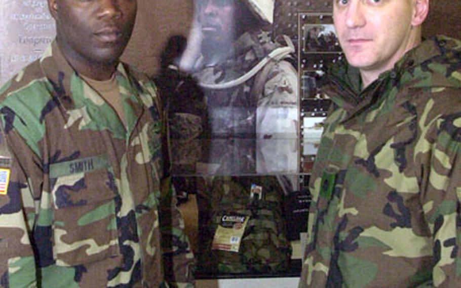 Seeing their experiences documented in a new gallery at the 1st Armored Division Museum took Sgt. David Smith, right, and Lt. Col. Brian McKiernan back to their 15 months in Iraq.
