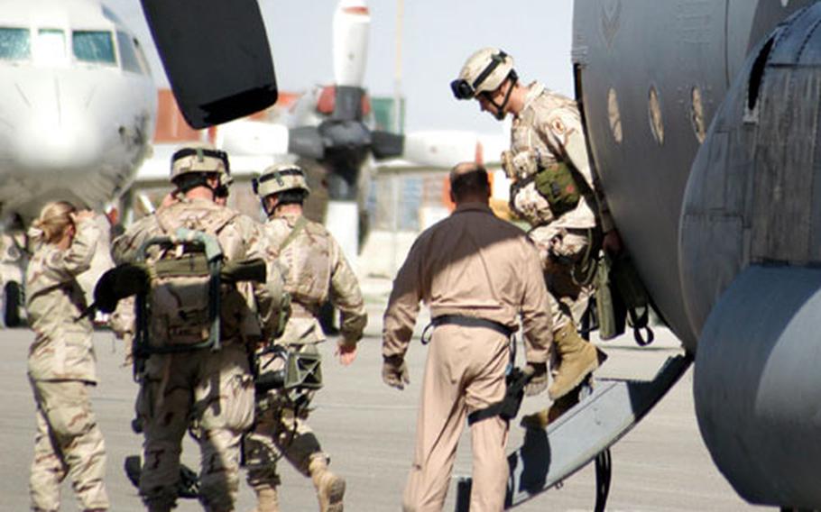 Soldiers from 2nd Battalion, 503rd Infantry (Airborne) step out of a C-130 Hercules on Sunday at Kandahar Airfield in Afghanistan. The battalion, based in Italy, assumed control this week in Zabul, southern Afghanistan.