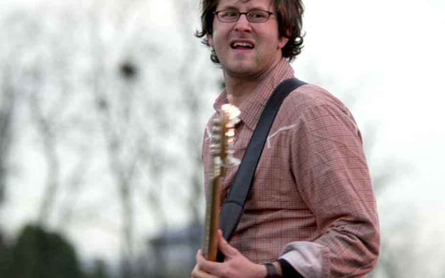 Guitarist Brian Smith of the Christian rock band Far From Home plays during a free concert Sunday at Yongsan Garrison, South Korea.