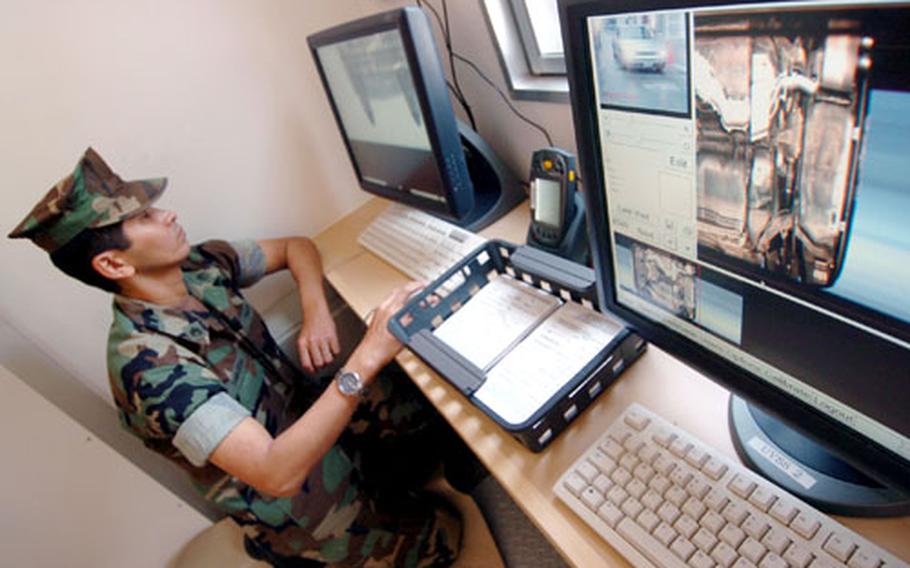 New gate security at Yokosuka Naval Base incorporates cameras that capture images from underneath vehicles entering the Japan base.