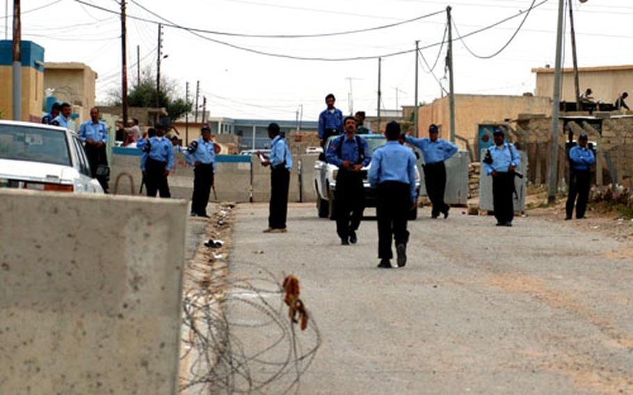 Iraqi police officers mill in front of the Tal Abtha police station and linger around the station’s only pickup truck. They still have not grasped the concept of foot patrols and revert to old practices of staying at the station to wait for trouble to find them, instead of seeking it out.