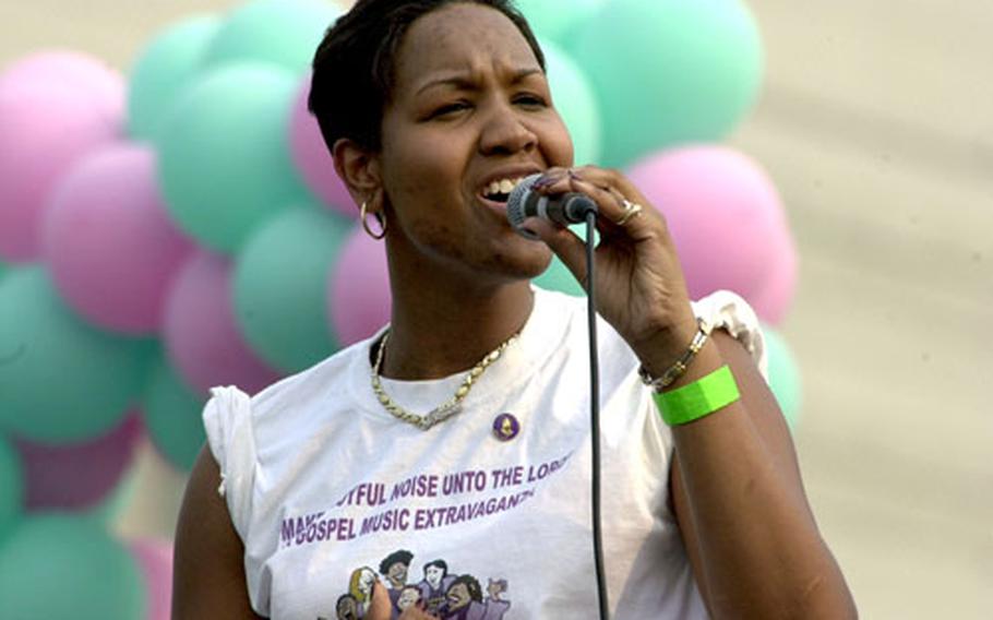 Army Staff Sgt. Shaunna Douglas sings during the finals of the “Korean Idol” contest at the Community Festival 2005 at Yongsan Garrison, South Korea. Douglas won the competition and a round-trip ticket to the States.