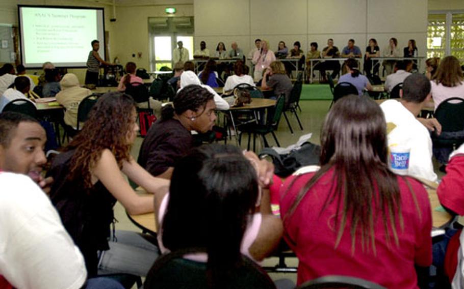 Teens and parents gather in the Kubasaki High School cafeteria for Camp Foster's first teen forum.