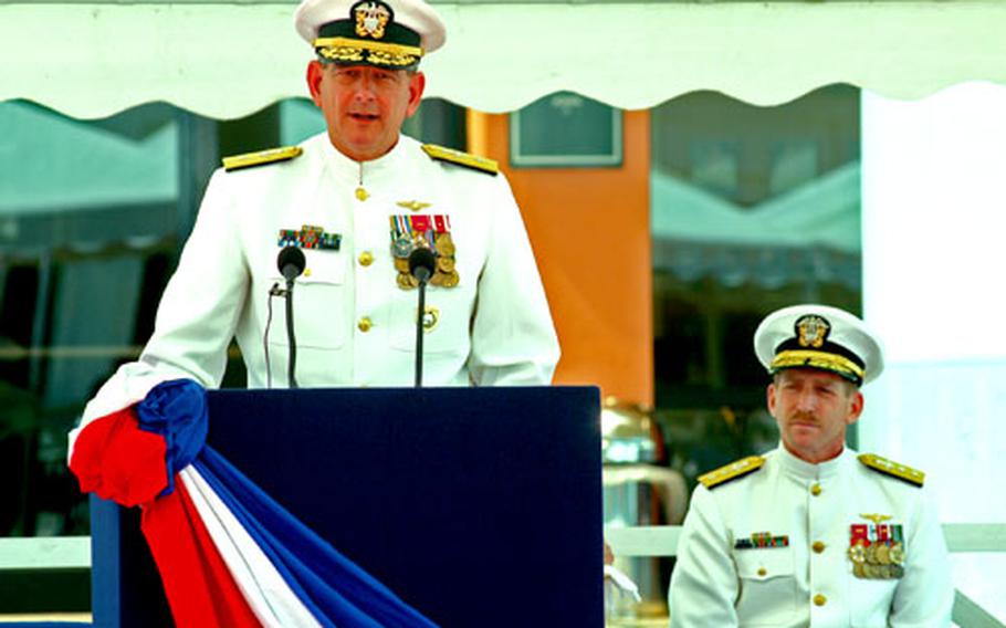 Rear Adm. Stanley Bozin speaks before turning command of Navy Region Europe and NATO’s Maritime Air Naples to Rear Adm. Noel Preston, right, during a ceremony Friday at Naval Support Activity Naples.