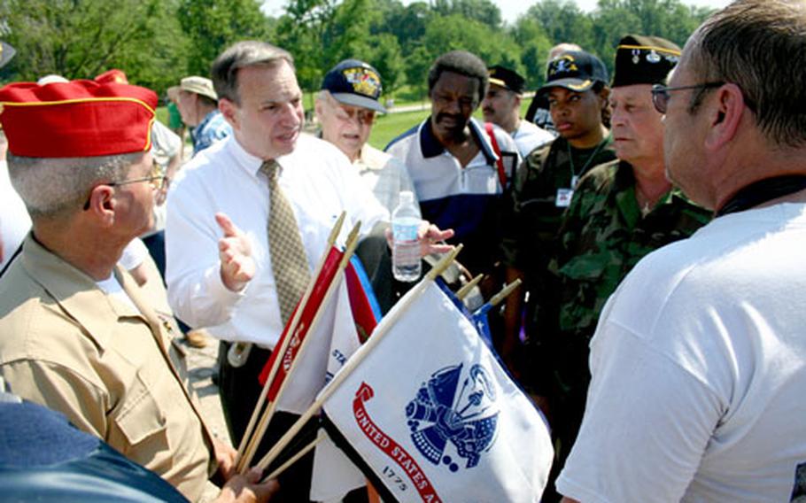 Rep. Bob Filner, D-Calif., second from left, talks to a group of veterans, including Gene Simes, far left, president of the Veterans for Veteran Connection, Inc., during Wednesday’s rally in Washington.