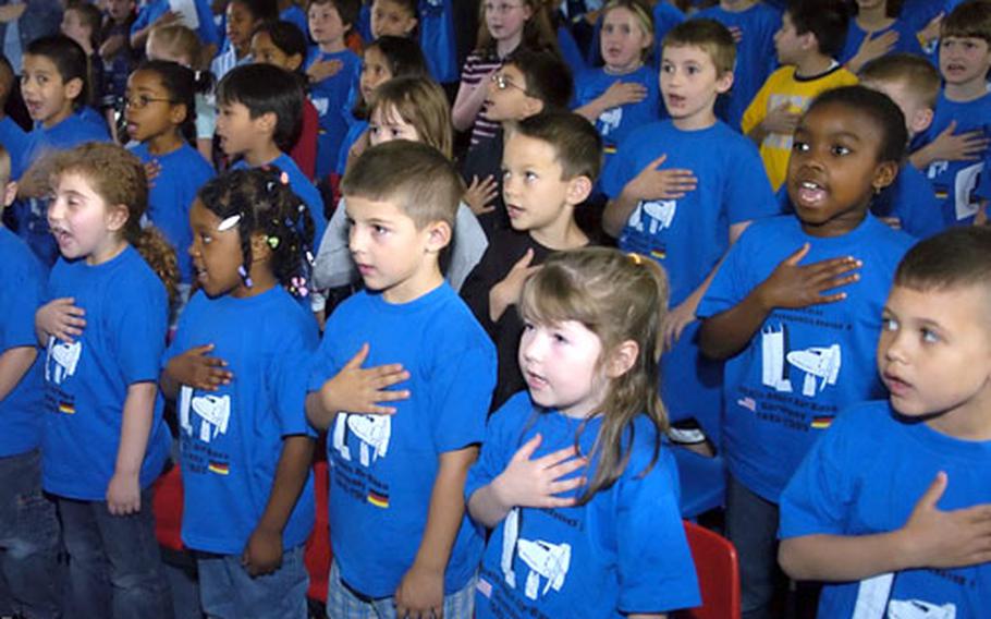 Halvorsen Tunner Elementary-Middle School students say the Pledge of Allegiance Thursday during the school’s closing ceremony. The Rhein-Main Air Base School closes its doors for good Friday after serving U.S. military families for more than 55 years.