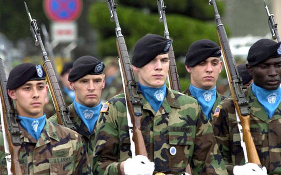 Members of the United Nations Honor Guard march during the departure ceremony Thursday at Yongsan Garrison, South Korea.