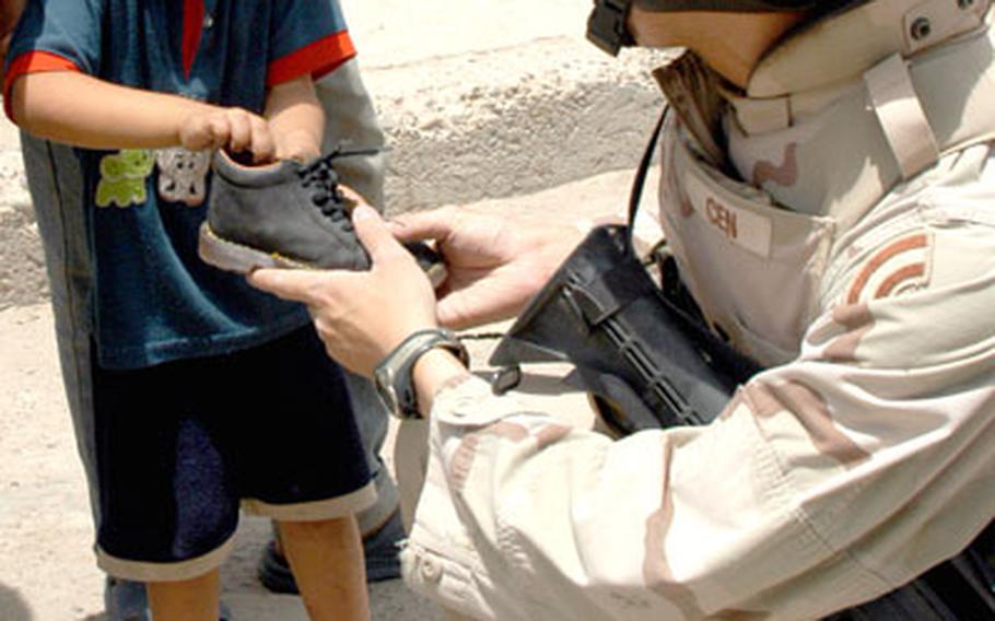 Thursday’s two-hour mission for soldiers with the New York National Guard’s 69th Infantry had two parts: record where water lines had been ruptured by U.S. vehicles on Airport Road, and give out shoes and toys to kids.