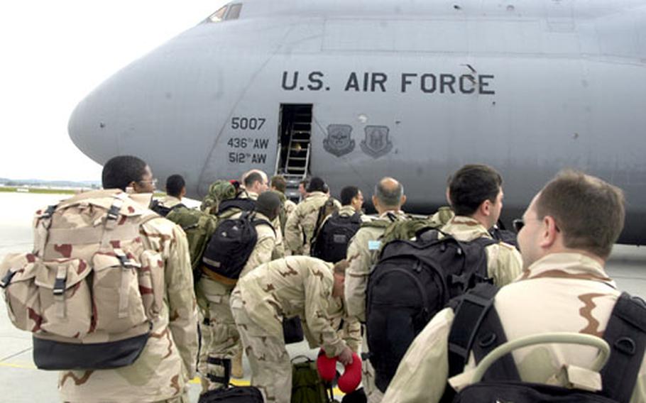 Soldiers from 1st Battalion, 10th Special Forces Group and other units board a plane Monday morning at the Stuttgart, Germany, airport on the way to Niger as part of Flintlock 05, a seven-nation exercise to strenghten African armies and U.S.-African ties.