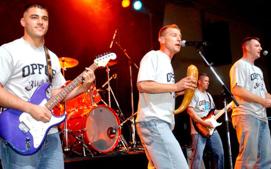From left: Kevin Taylor, Christopher Rodriquez and Fred Velez of the band Black Box 60 perform in August at the U.S. Army Europe’s annual Battle of the Bands.