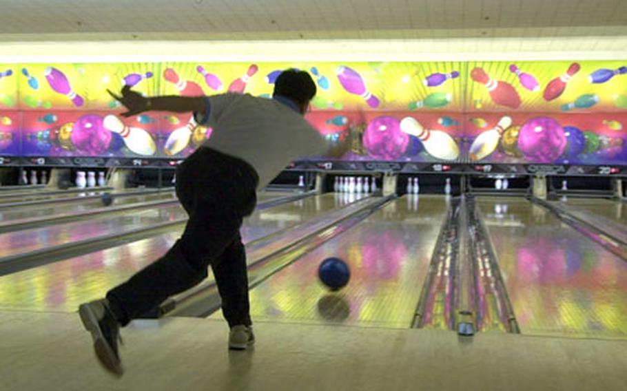 A bowler warms up Sunday during the Asian-American Friendship Bowling Tournament at Yongsan Lanes, on Yongsan Garrison in South Korea.