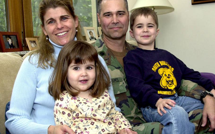 Lt. Col. T.C. Williams with his wife, Helen, and his children, Katie, 2, and Cort, 5, at their home on H.D. Smith Barracks in Baumholder, Germany.