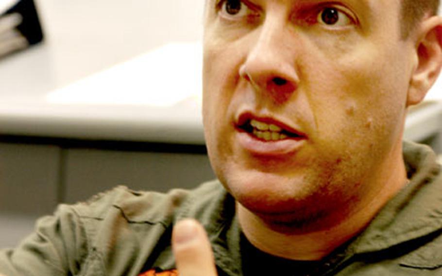 During an interview Tuesday at Atsugi, Lt. Cmdr. Tom Long, a C-130 pilot from VR-64, talks about the ways his squadron helps Navy logistics.