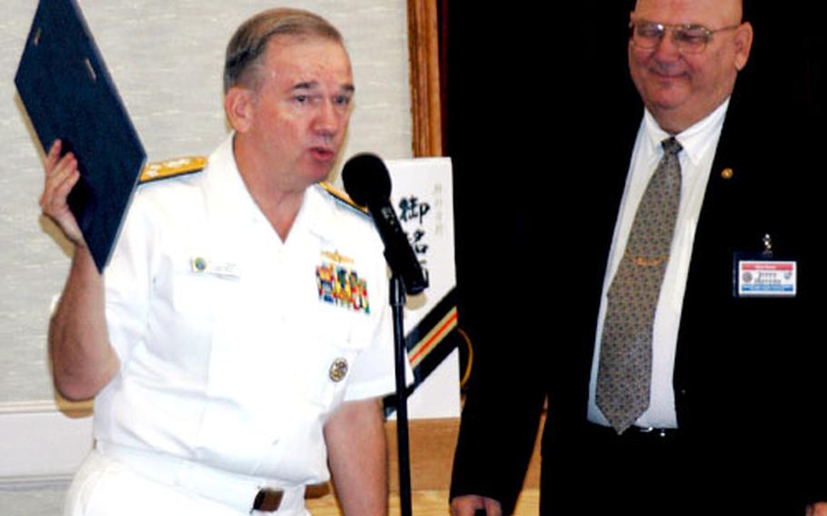Adm. Walter F. Doran, left, commander of the Pacific Fleet, thanks the Sasebo Council of the Navy League at a breakfast Wednesday at Sasebo Naval Base, Japan, after league president Jerry Havens gave him a plaque expressing appreciation for his Naval service.