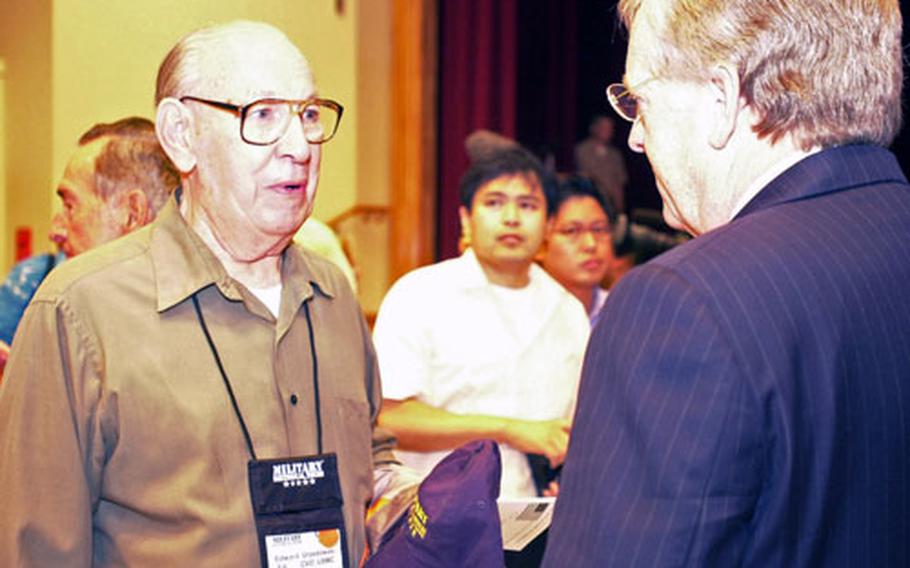 Former Marine and Battle of Okinawa veteran Edward Urzedowski, left, talks with U.S. Ambassador to Japan John Thomas Schieffer after the Battle of Okinawa 60th commemoration cermony Friday morning on Camp Foster.