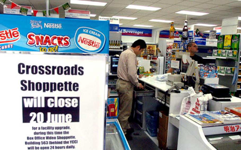 A customer makes a purchase at the Crossroads Shopette at Yokota Air Base, Wednesday. The Shopette will close June 20 for approximately six weeks for renovations.