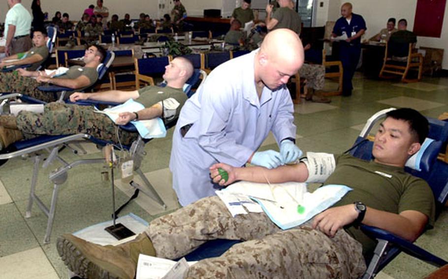 The Armed Forces Blood Bank Center soon will hold blood drives — like this one on Camp Kinser in October — in Guam, South Korea and mainland Japan.