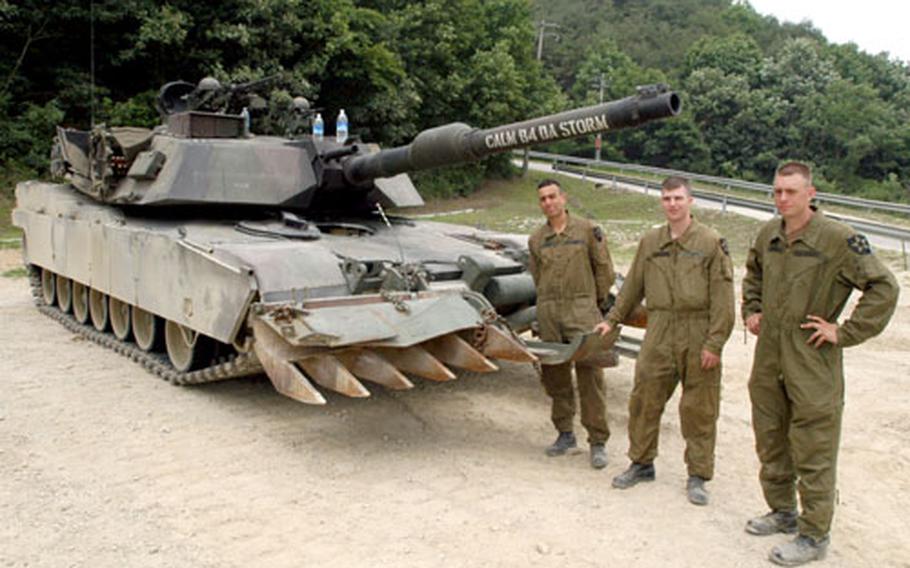 From left, Pfc. Jaime Antolec, Cpl. Evan Chase and Pfc. Jesse Swafford practiced gunnery with their 1-72 M1A1 Abrams Main Battle Tank at Rodriguez Range on Tuesday.
