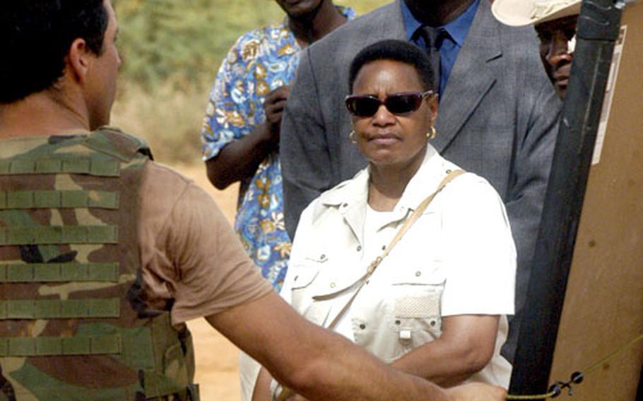Denise Mathieu, the U.S. ambassador to Niger, listens to a briefing about Tuesday afternoon’s live-fire exercise by Nigerien troops.