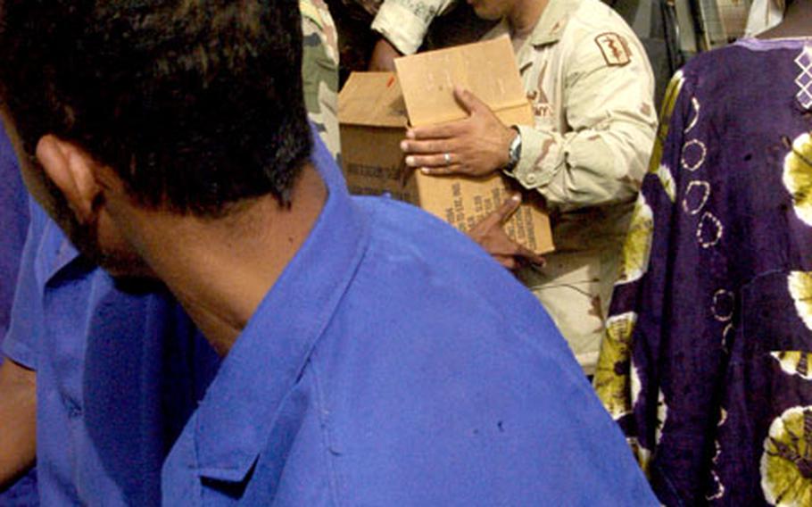 Dr. (Maj.) Imad Haque of the 160th Forward Surgical Team helps deliver medical supplies last week at a maternity clinic in Tahoua, Niger.