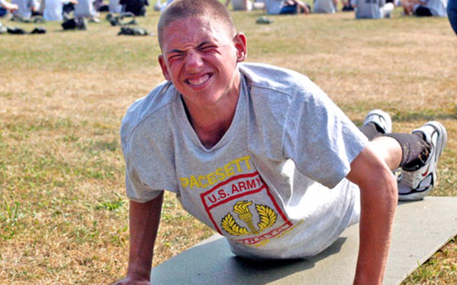 Junior Reserve Officers’ Training Corps cadet Josh Fanti, 15, from Wiesbaden, Germany, strains his guts out to finish one more push-up during the final physical training competition of the JROTC’s annual summer camp at the Grafenwöhr training area Tuesday. Fanti was one of 113 high school students who spent 10 days honing everything from orienteering to canoeing skills at the camp, which ends Wednesday.