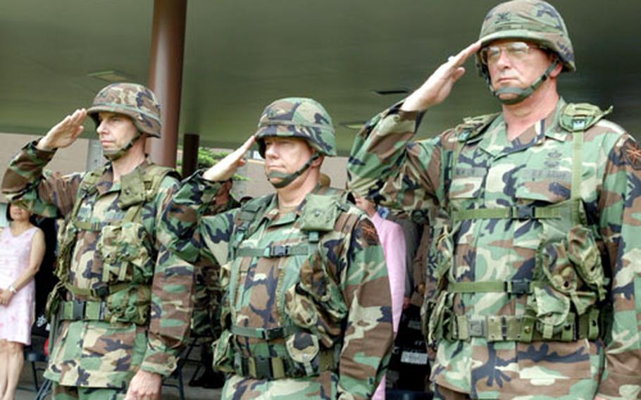 From left: Col. Jeffrey T. Christiansen, Brig Gen. Harvey T. Landwermeyer Jr. and Col. Forrest R. Newton at the Area I change-of-command ceremony on Thursday. Newton took command from Christiansen.