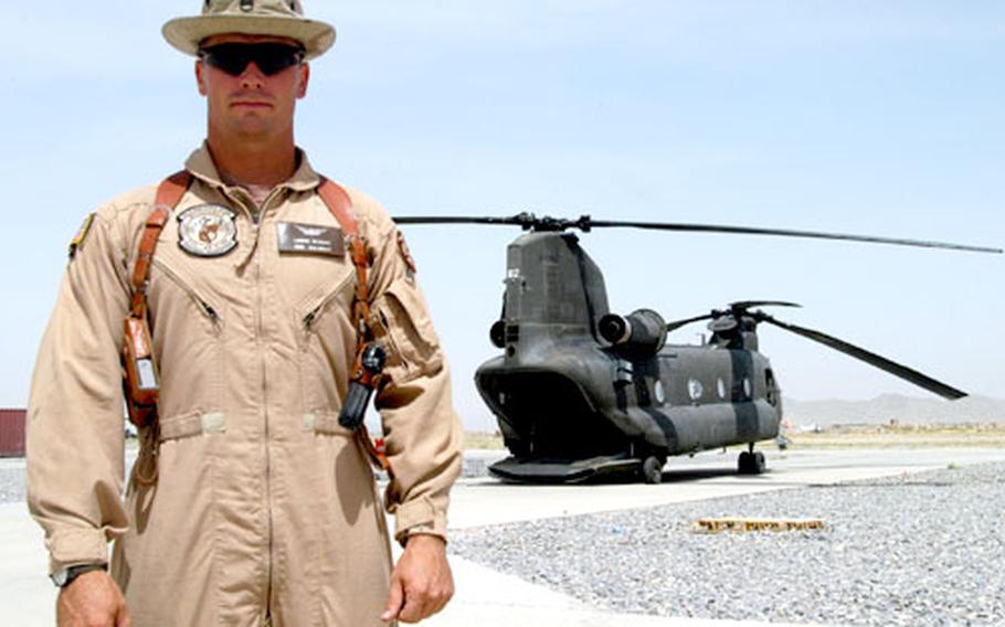 Staff Sgt. Lance Albert, 35, a CH-47 crew chief from the 113th Aviation Regiment of the Nevada Army National Guard, used a 5-gallon water bucket to douse a fuel-fed fire caused by enemy bullets June 21 during a battle in eastern Afghanistan.
