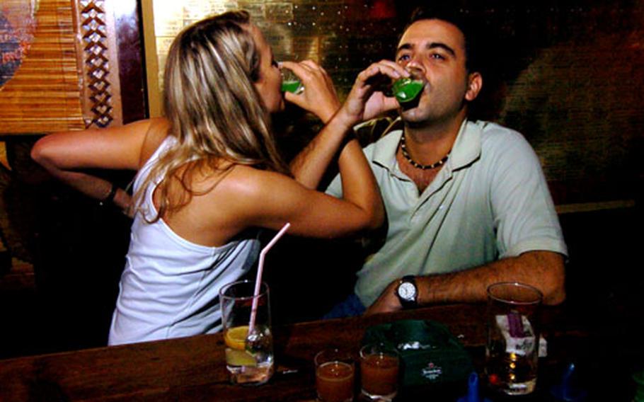 Shots with a friend are a popular pastime for visitors to downtown Tokyo’s Roppongi district. The U.S. Embassy, U.S. Forces Japan and Japanese law enforcement are cautioning visitors to be vigilant as crime against foreigners — including American military personnel — in the area has increased in recent months.