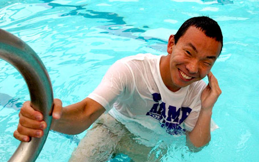 Camp Adventure counselor Nathan Joyce recovers from a dunking at the Camp Red Cloud pool on Tuesday.