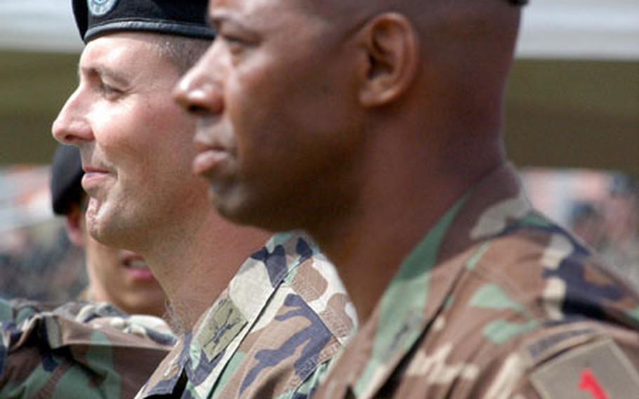 The incoming commander of the 3rd Brigade, 1st Infantry Division, Lt. Col. Michael Todd, left, will oversee the unit’s transformation. Outgoing commander Col. Dana Pittard stands next to him.