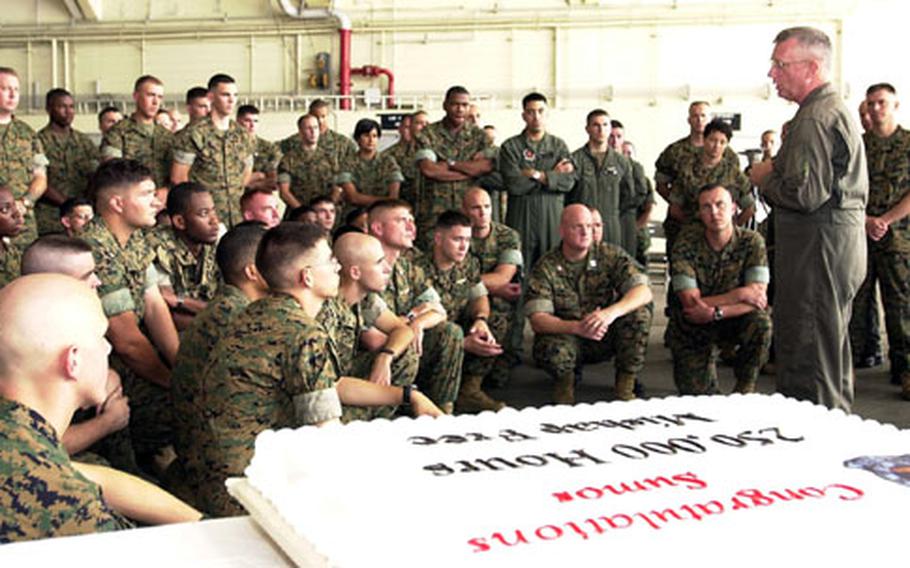 Brig. Gen. George Trautman, right, commanding general of the 1st Marine Aircraft Wing, talks to Marines and sailors of Marine Aerial Refueler Transport Squadron 152 during a short ceremony Thursday honoring their 250,000 class "A" mishap-free flight hours.