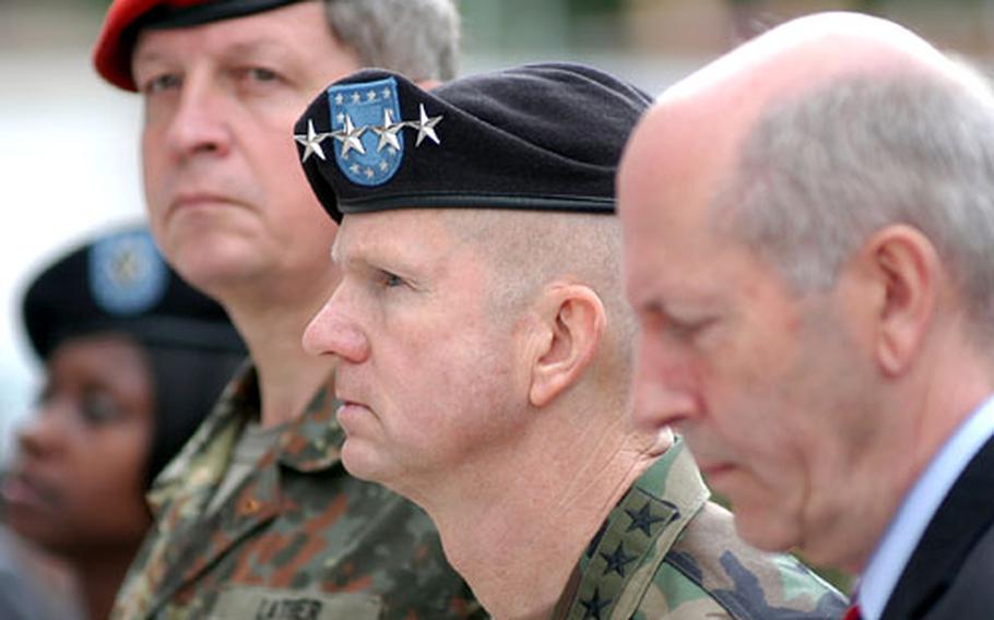 Gen. B.B. Bell, commander of NATO's Allied Land Component Command and United States Army Europe, center, listens to speeches at the topping-out ceremony for the command's new headquarters building in Heidelberg, Germany on Friday. At left is the deputy commander, German Lt. Gen. Karl-Heinz Lather and at right Klaus-Günther Biederbick, an undersecretary in Germany's ministry of defense.