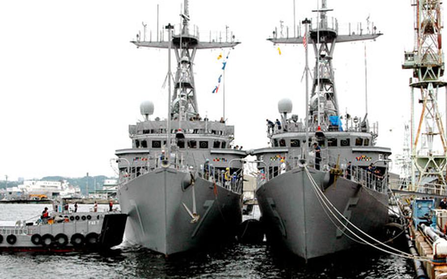 The USS Patriot, left, sits alongside the USS Guardian on Friday as the minesweepers returned to Sasebo Naval Base, Japan, from Vladivostok, Russia, where they participated in the first exercise involving U.S. minesweepers and the Russian Federation Pacific Fleet.