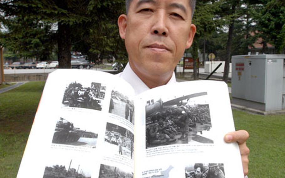 Area I community relations officer Kil Kwang-chun hopes his new book of Korean War photographs will help young South Koreans to learn about the conflict.
