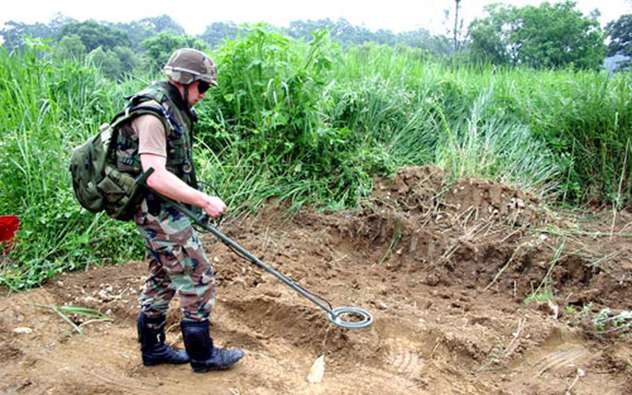 An EOD soldier searches for land mines in this undated U.S. Forces Korea photo.