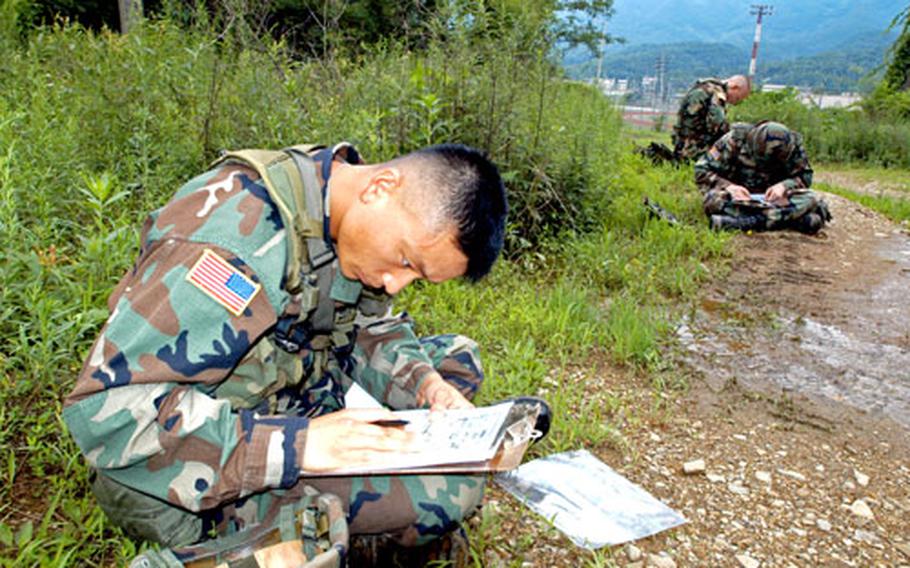 Sgt. Kim Woo-jin, 33, of Company C, 168th Medical Battalion, competes in the land navigation component of the 8th Army Soldier of the Year competition at Camp Casey, South Korea, on Tuesday.