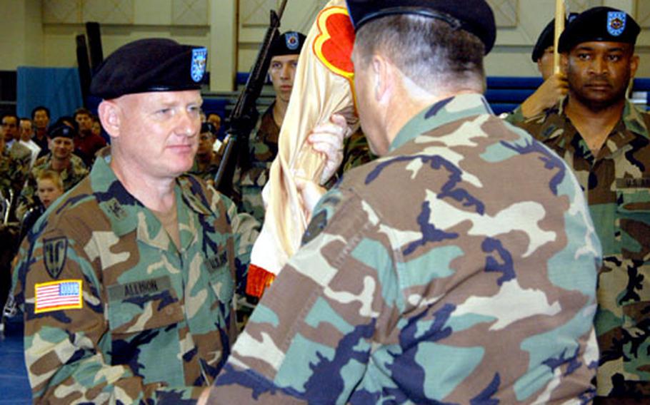 During a July 8 change-of-command ceremony at Camp Carroll in South Korea, Col. Campbell D. Allison, left, assumes command of the Army’s Materiel Support Center-Korea, the U.S. military’s big supply and maintenance depot on the peninsula.