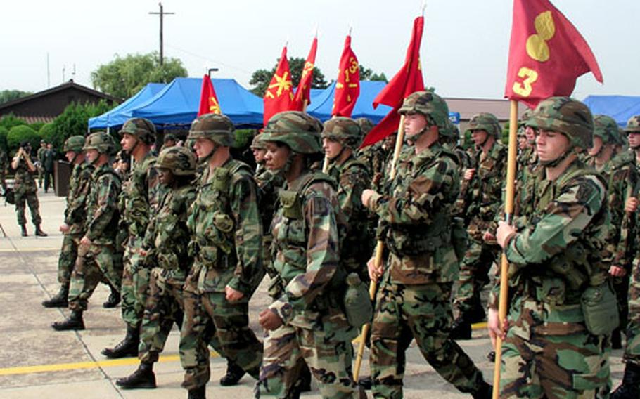 At Osan Air Base in South Korea on Friday, troops of the U.S. Army’s 35th Air Defense Artillery Brigade pass in review during a change-of-command ceremony in which Col. John G. Rossi assumed command of the brigade, a Patriot missile unit.
