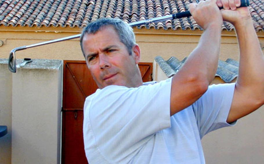 Petty Officer 1st Class Terry Burnley keeps his golf game in tune at his home in La Maddalena, Sardinia.