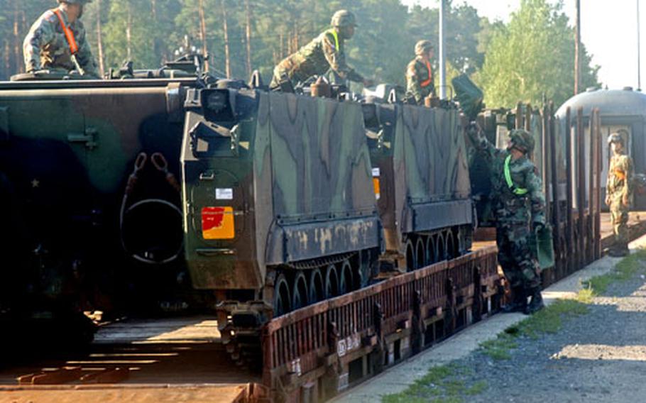 Soldiers from the 1st Infantry Division’s 3rd Brigade loaded 20 M1A1 Abrams tanks and three Bradley fighting vehicles onto rail cars Wednesday at Rose Barracks in Vilseck, Germany. The tanks were being taken to the Army Material Command and will be used later in the war on terror. The Army confirmed Monday that the 3rd Brigade is being downsized in Vilseck to make room for a Stryker Brigade Combat Team.