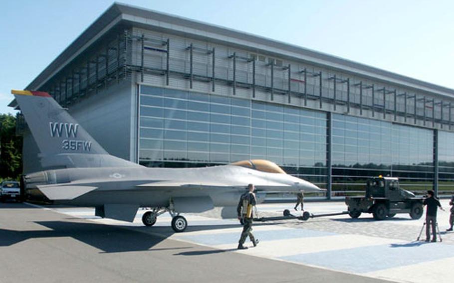An F-16 on loan to the Misawa Aviation and Science Museum from the 35th Fighter Wing was towed to the museum grounds Tuesday morning.